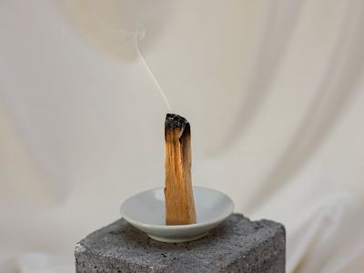 Close up of incense sticks and yoga blocks