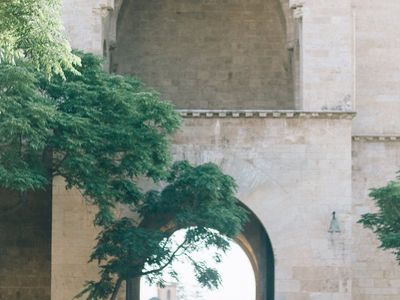 Person balancing on one leg in a dim room